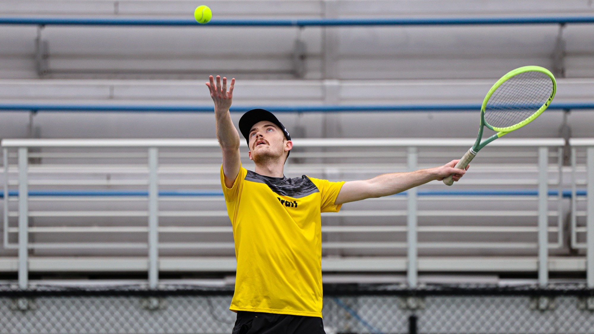 Brian Duval tosses the ball to serve