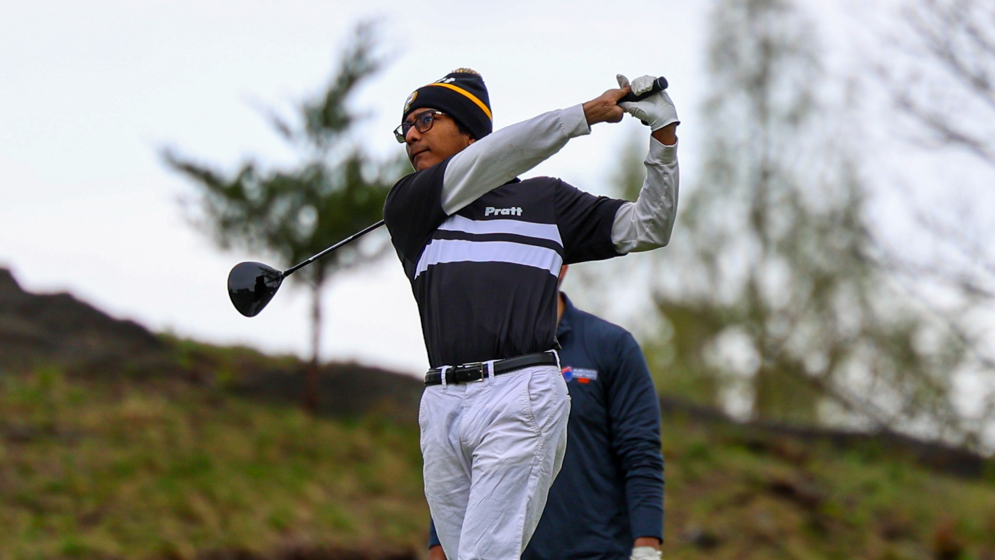 Gauthama Thiruvengadam follows through on a drive on the par 4 sixth hole at Hampshire CC.