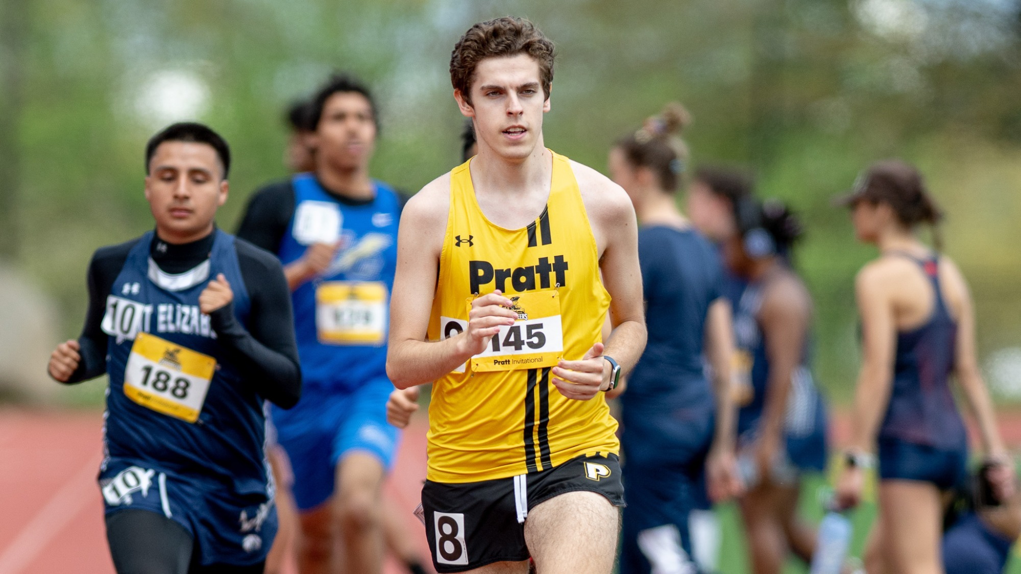 Jackson Brock runs in the 3,000 meter run at the Pratt Invitational