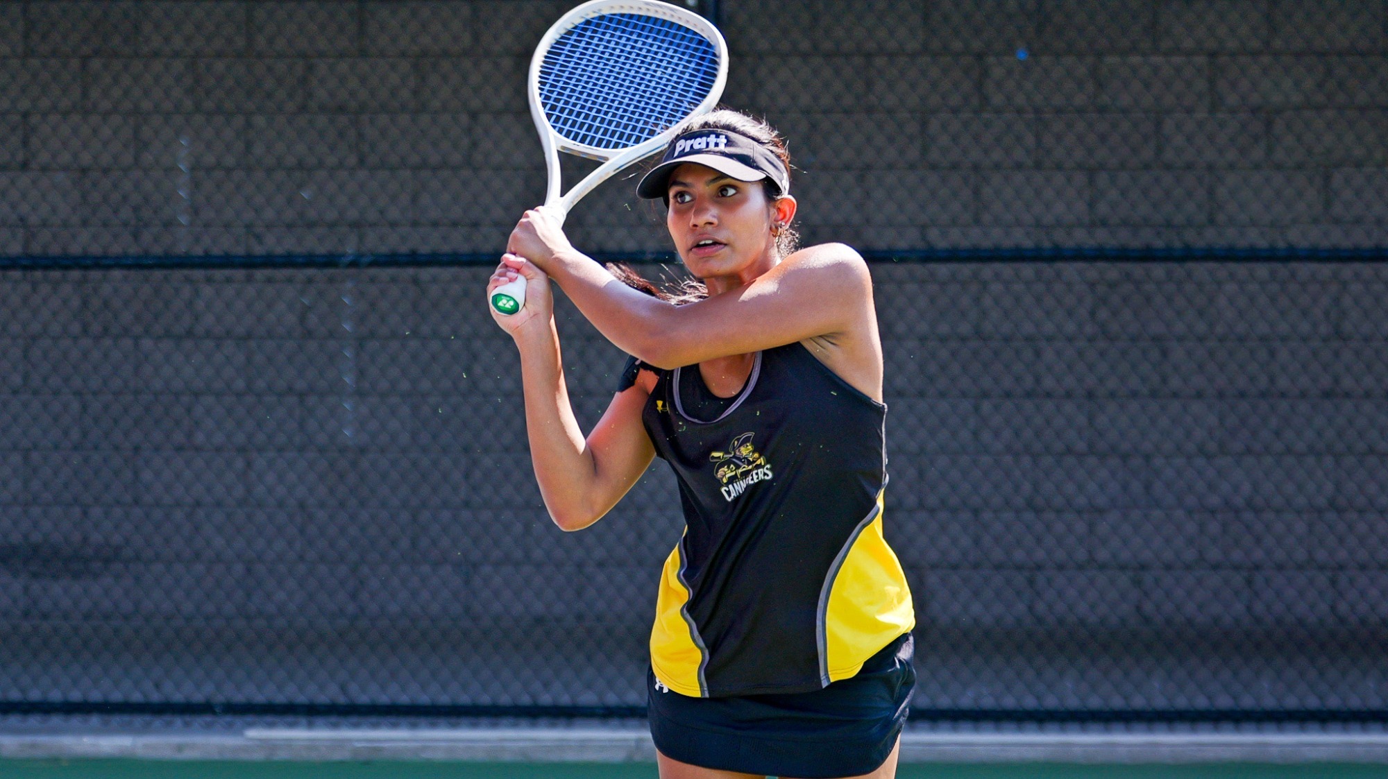 Pallavi Verghese hits a two-handed backhand