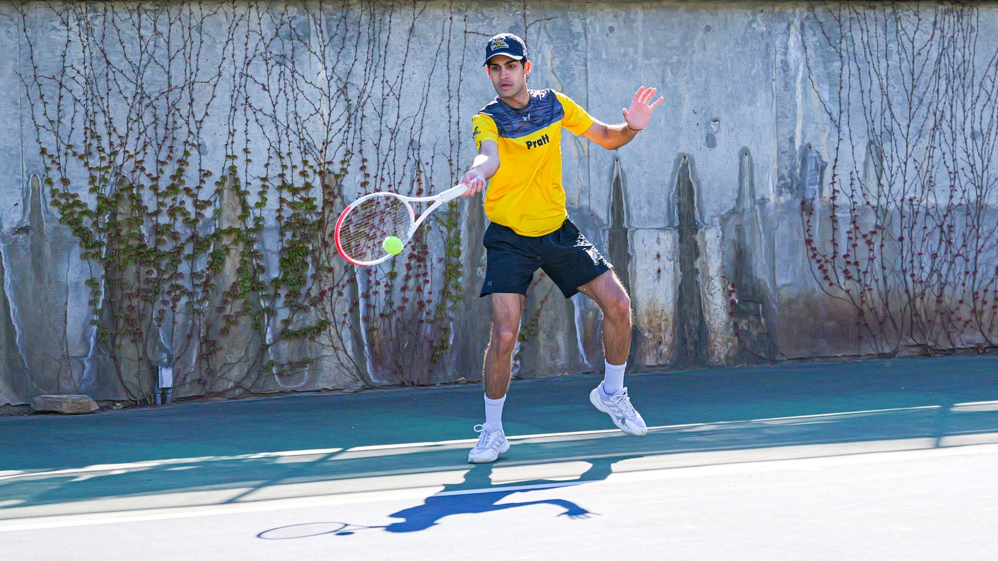 Aditya Shivkumar hits a forehand.