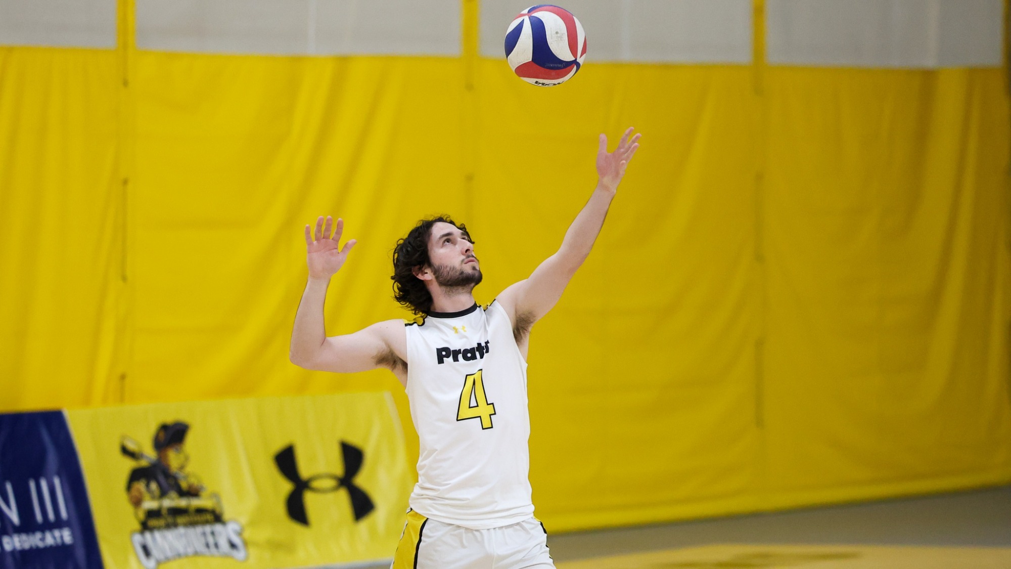 Jude Fox tosses the ball to serve
