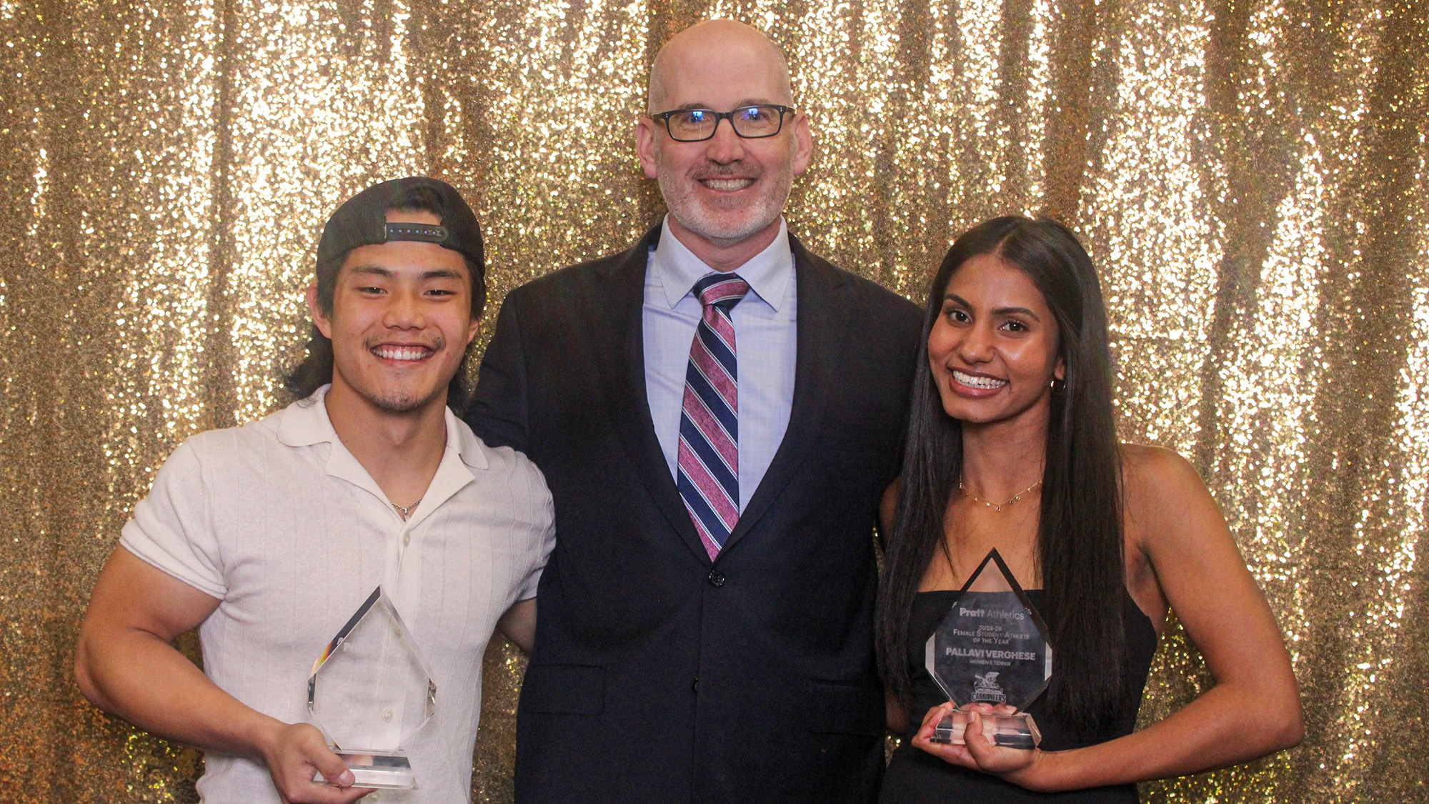 AD Walter Rickard with 2025-26 Student-Athletes of the Year, Mikah Liu (left) and Pallavi Verghese (right)