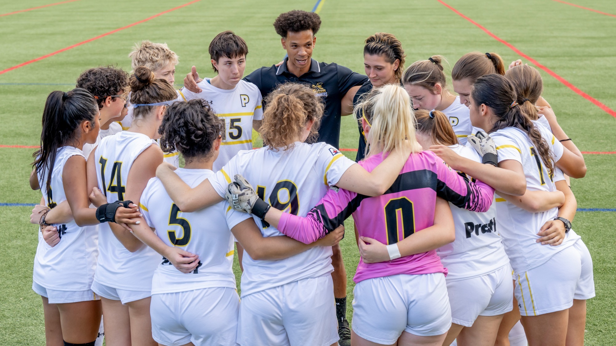 Women's Soccer in a huddle
