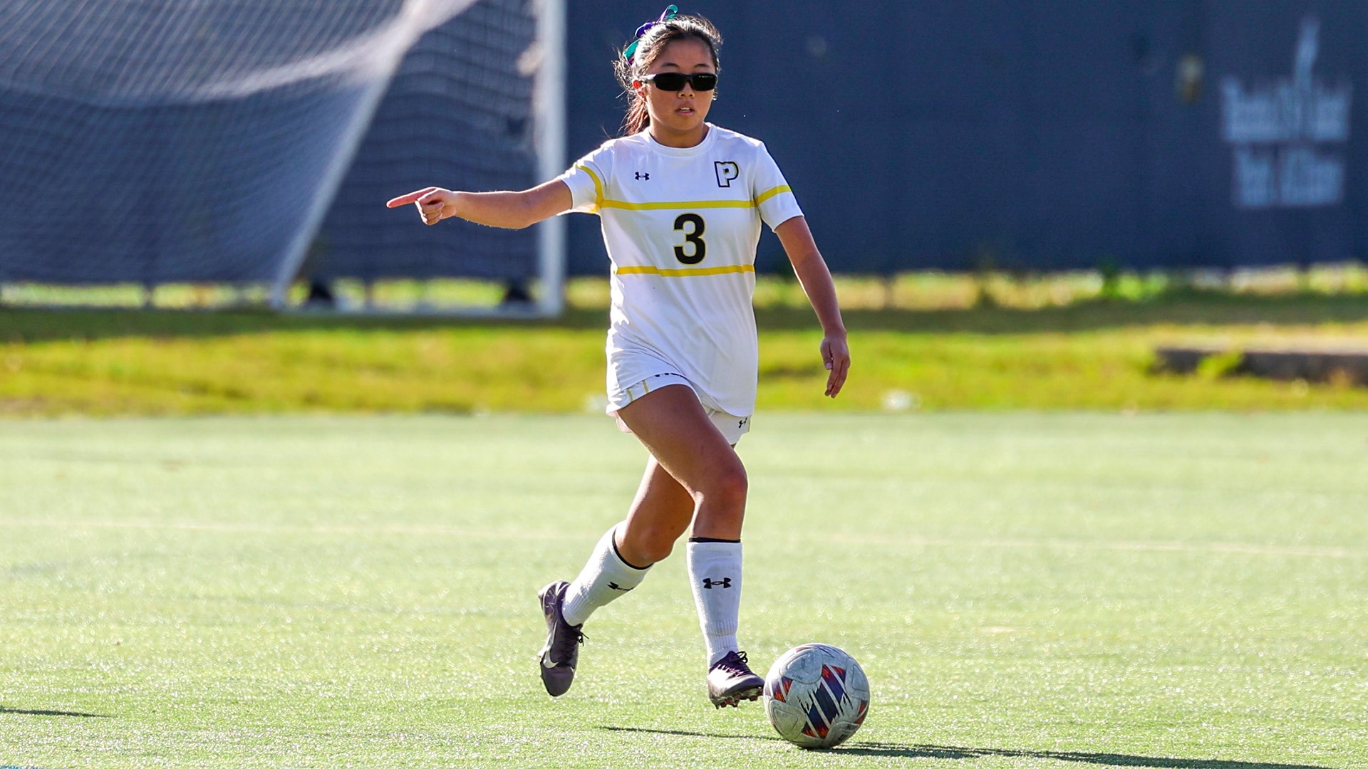 Chloe Tien dribbles in the midfield