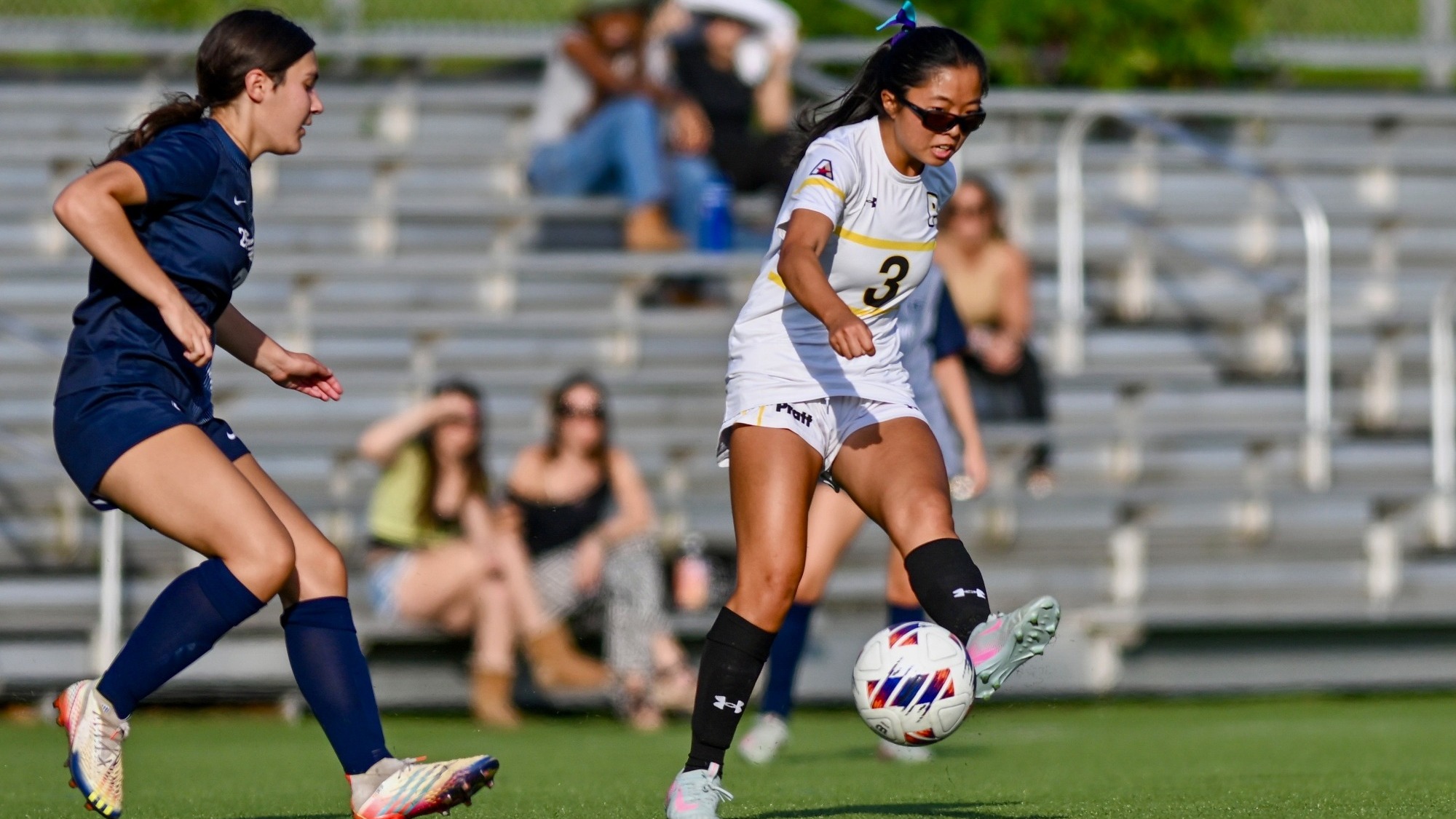 Chloe Tien kicks with her left foot
