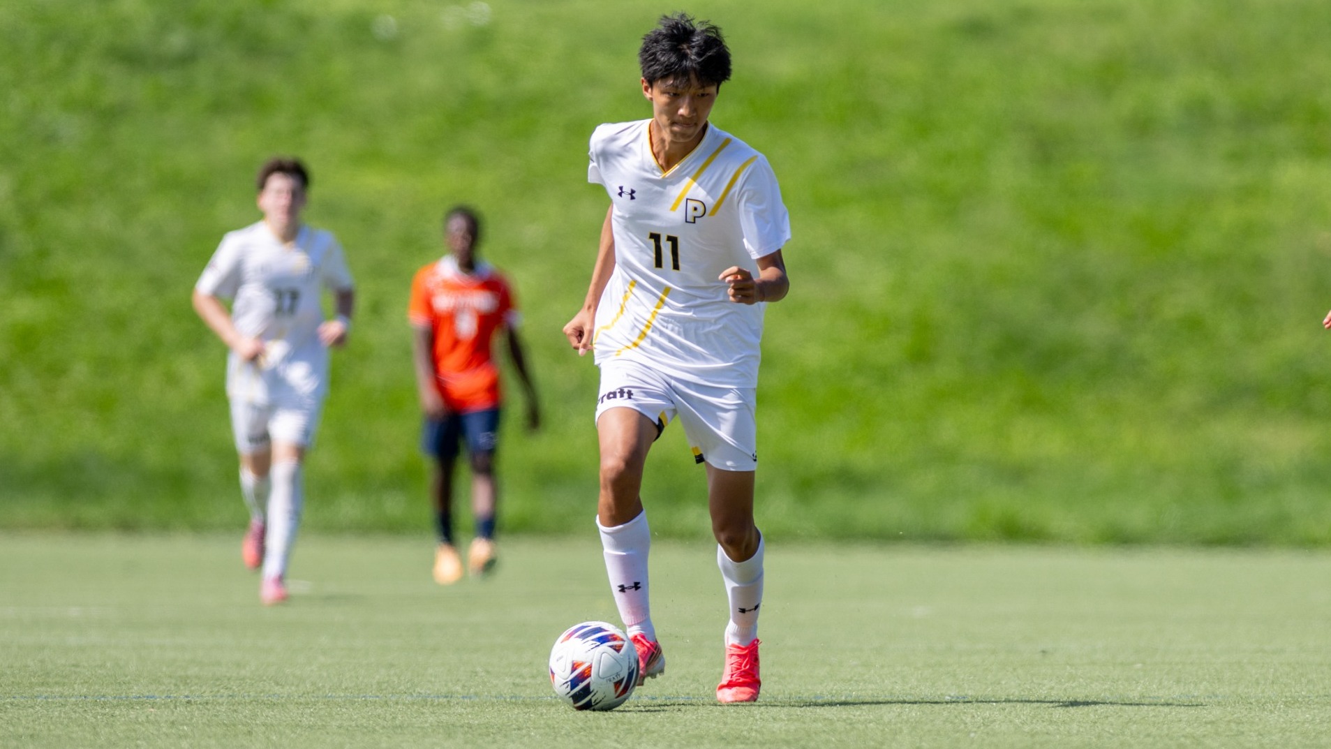 Yuming Liang dribbles