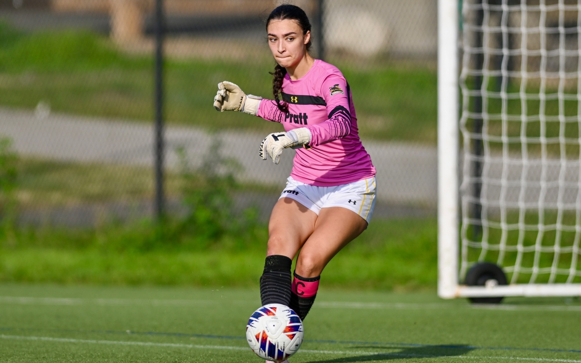 Savannah Depaz passes the ball with her right foot.