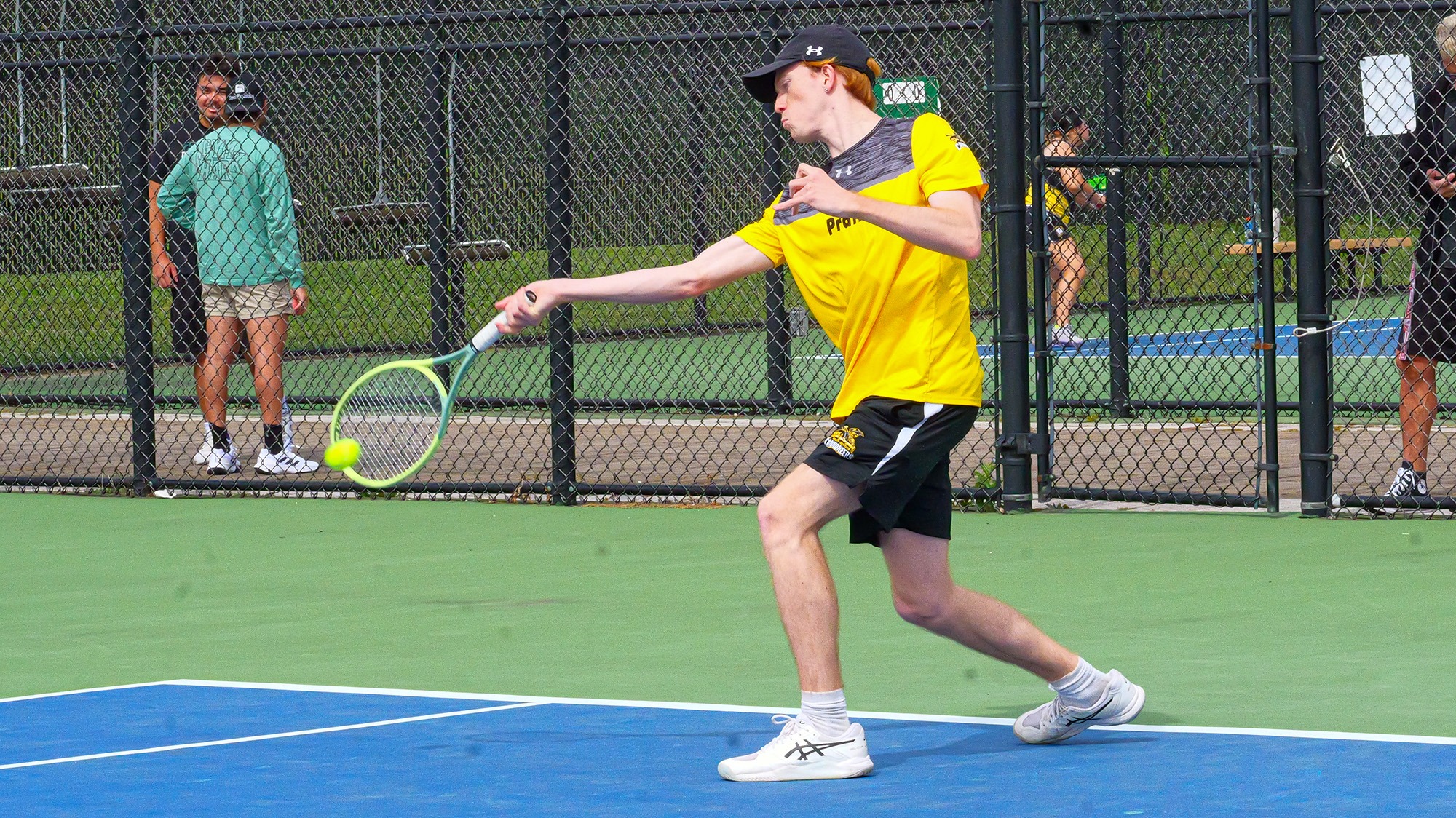 Calder Tillinghast hits a baseline forehand