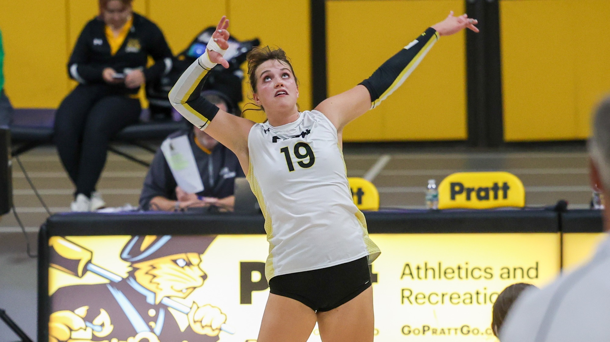 Colleen Russell jumps for a spike 