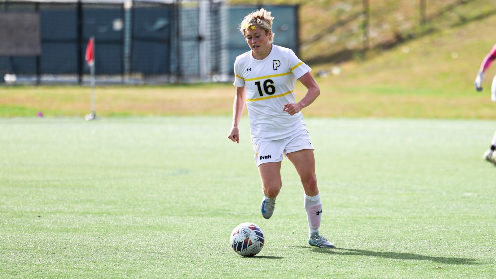 Josey Kanach dribbles the ball up