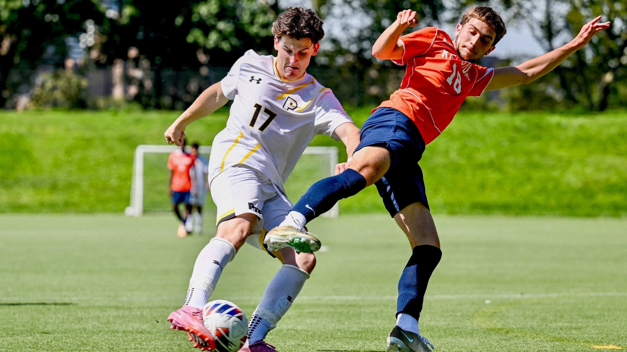 Alexander Litzenberger settles the ball with his right foot with a Keystone defender in front of him.