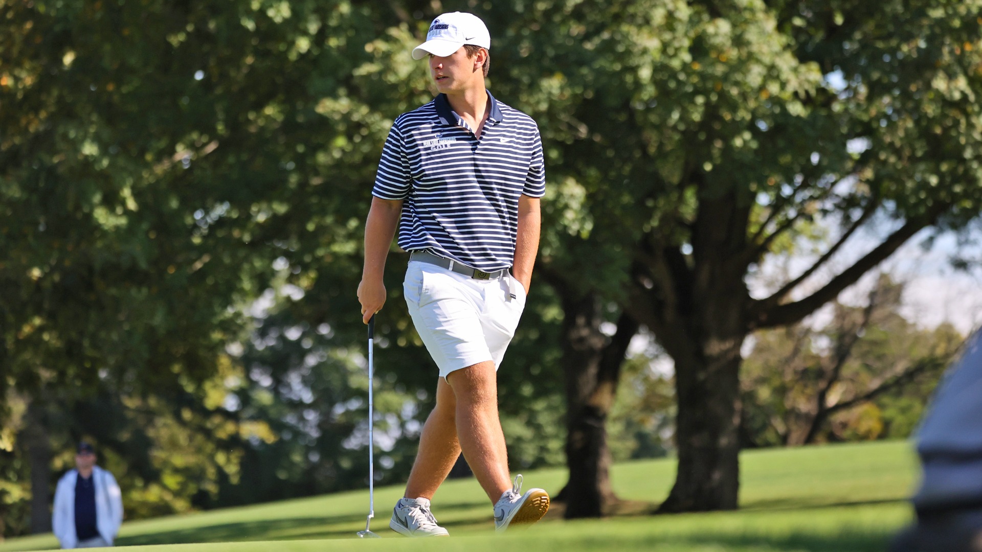 gavin fegley eyes up a putt during the etown invitational in the fall of 2025