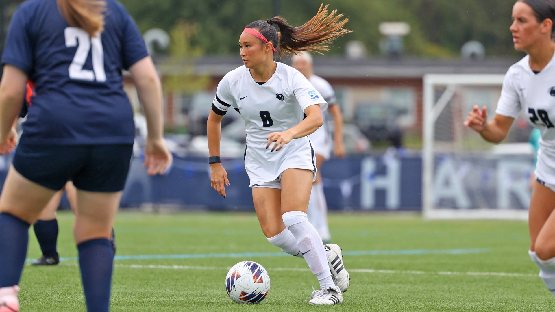 diana pon dribbles a ball through a pair of defenders during a win over keystone in 2025