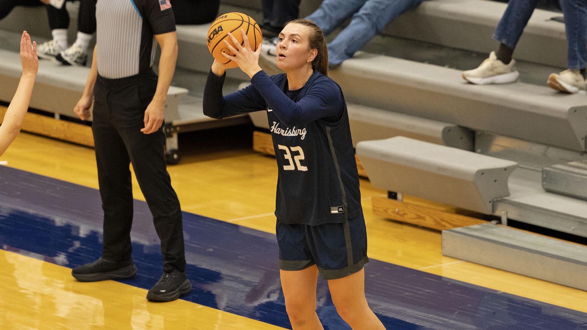 lauren moffatt shoots a three point shot at gettysburg