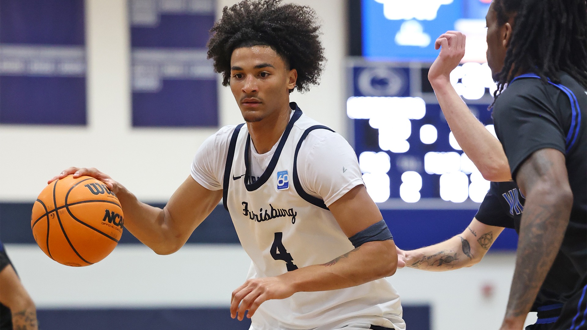 dylan moore dribbles in the paint during a win over wilson in 2025