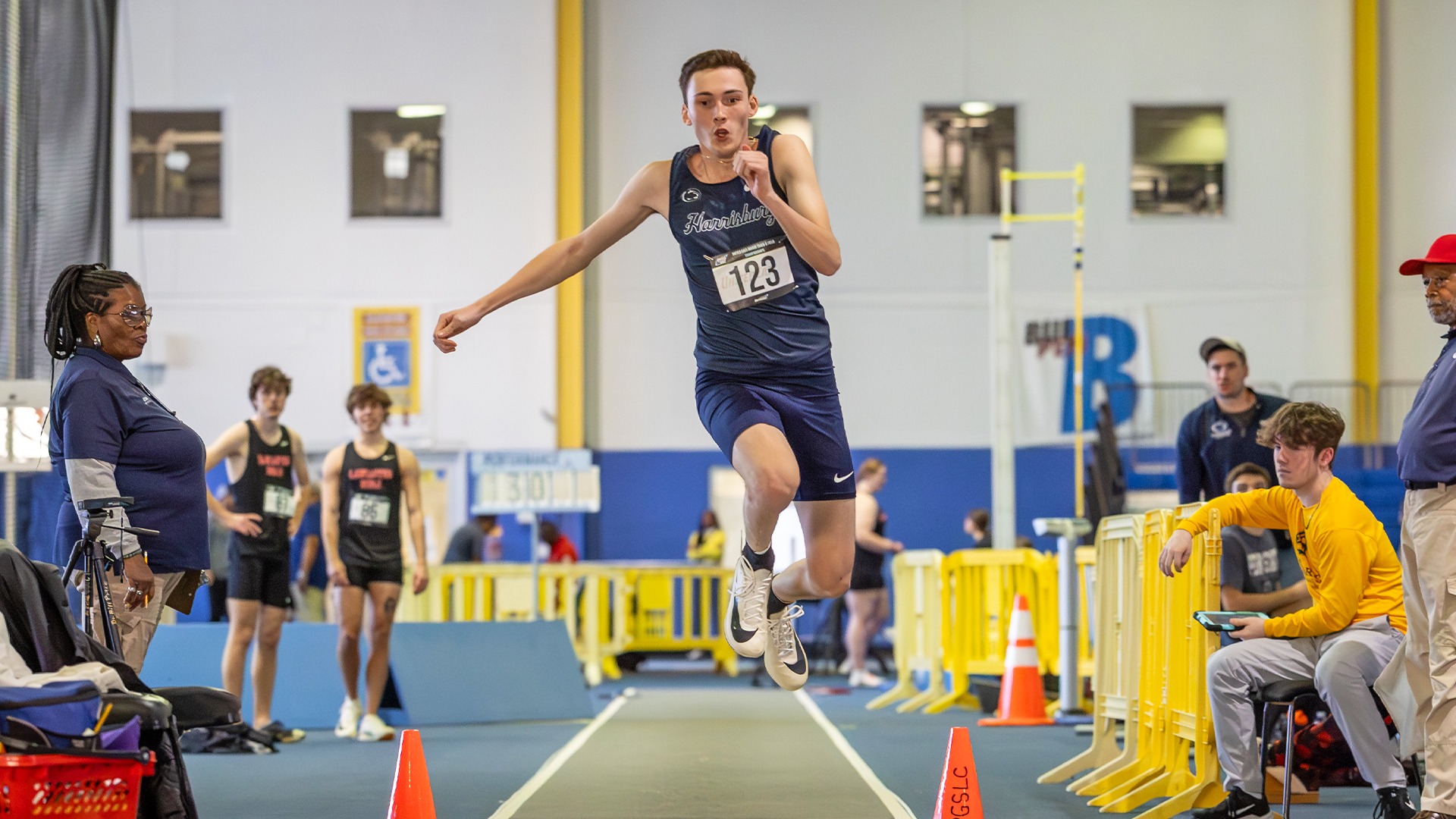 jonathan luo takes part in the triple jump during the 2024-25 united east indoor track & field championships