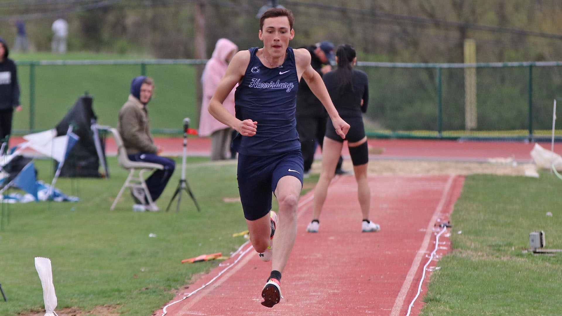 jonathan luo runs down the line to the triple jump pit at messiah in 2025