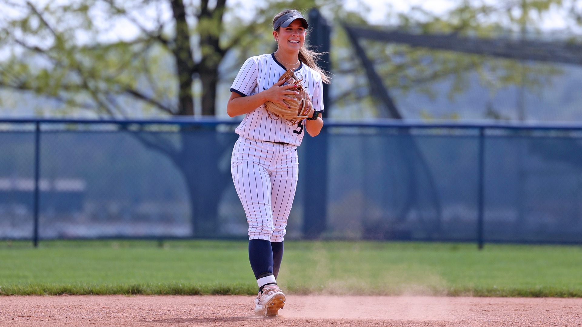maddy lehigh smiles from her shortstop position during a home game in 2025