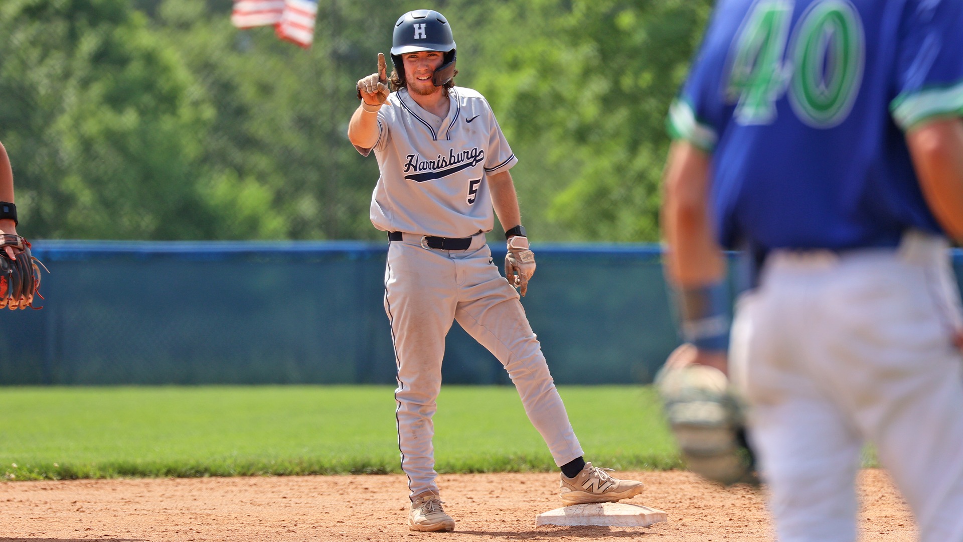 tim haftl holds up one finger at second base during an ncaa regional game against salve regina in 2025