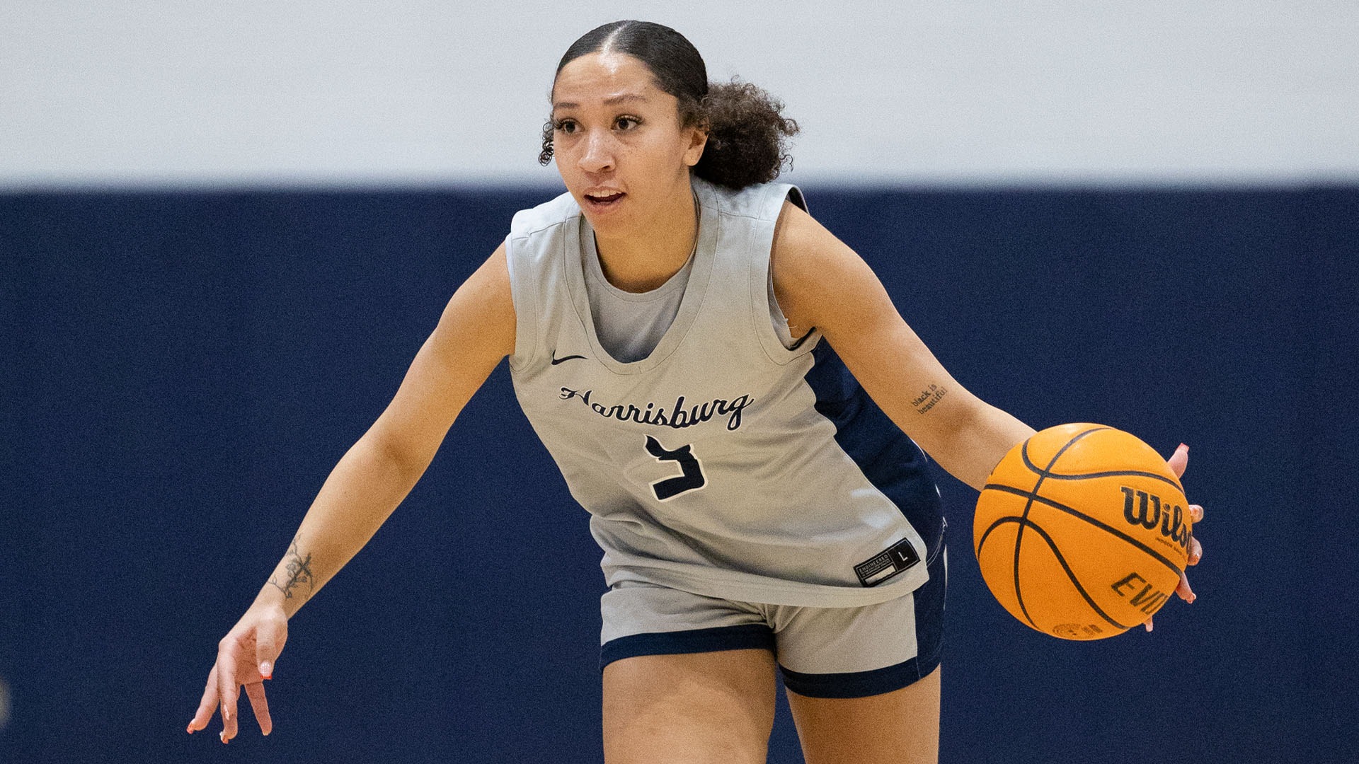mikayla coleman dribbles the ball down the court against penn state abington