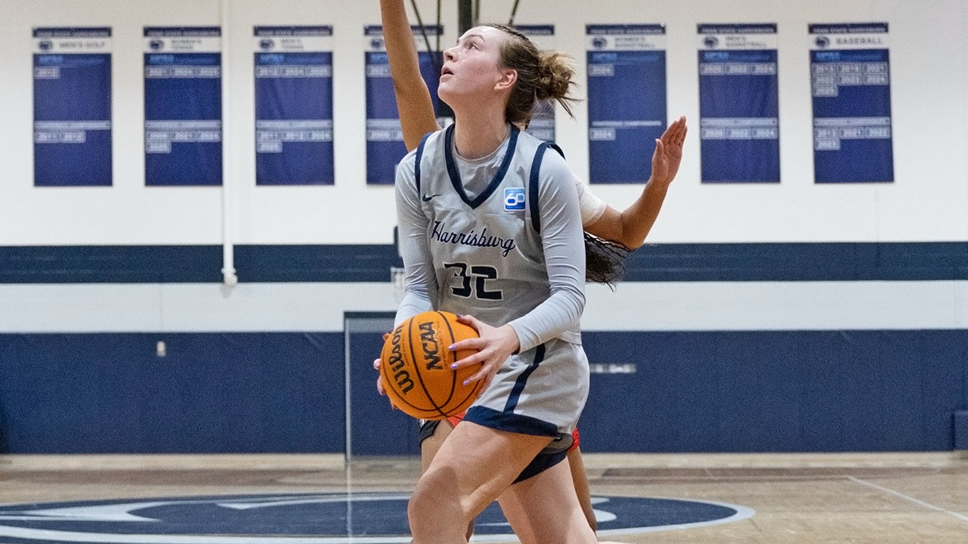 lauren moffatt drives to the basket against lancaster bible at the capital union building