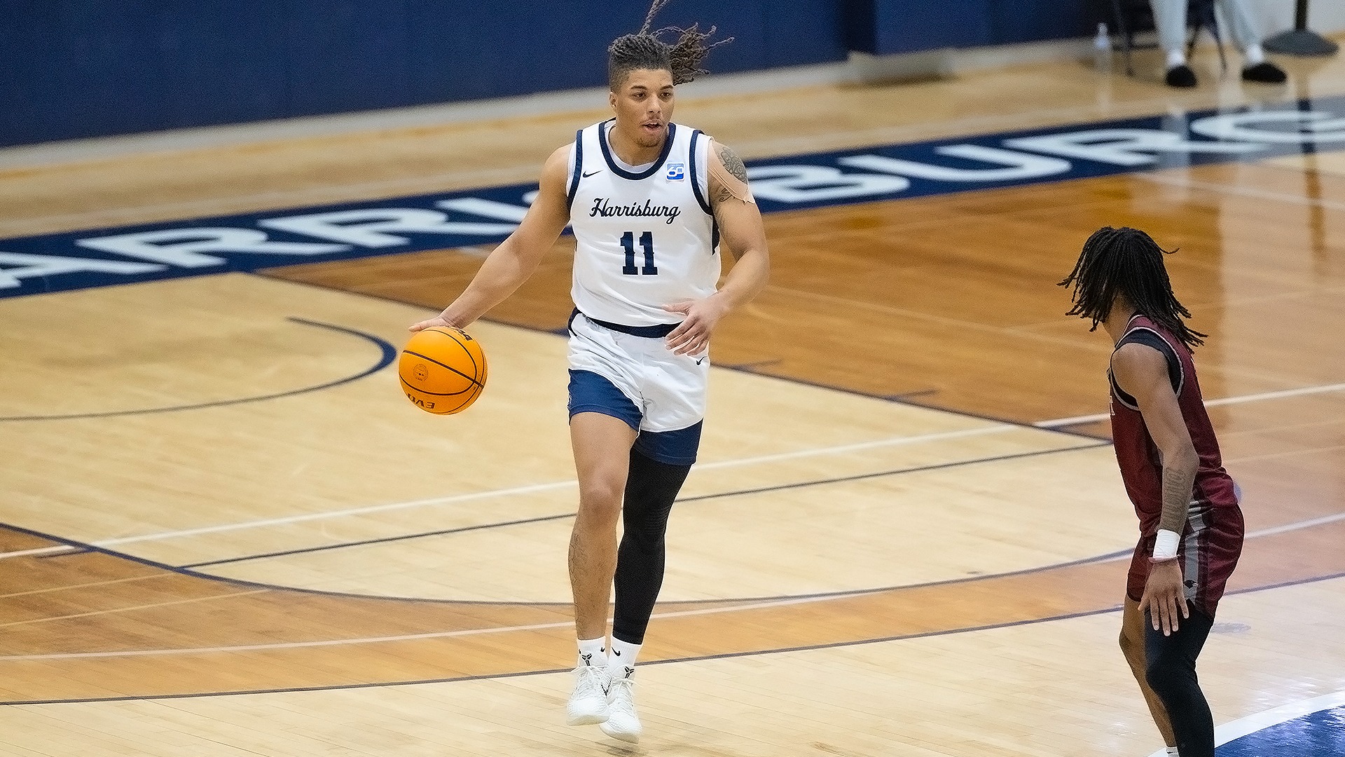 chris henderson dribbles the ball in the backcourt during a win over rosemont in 2026
