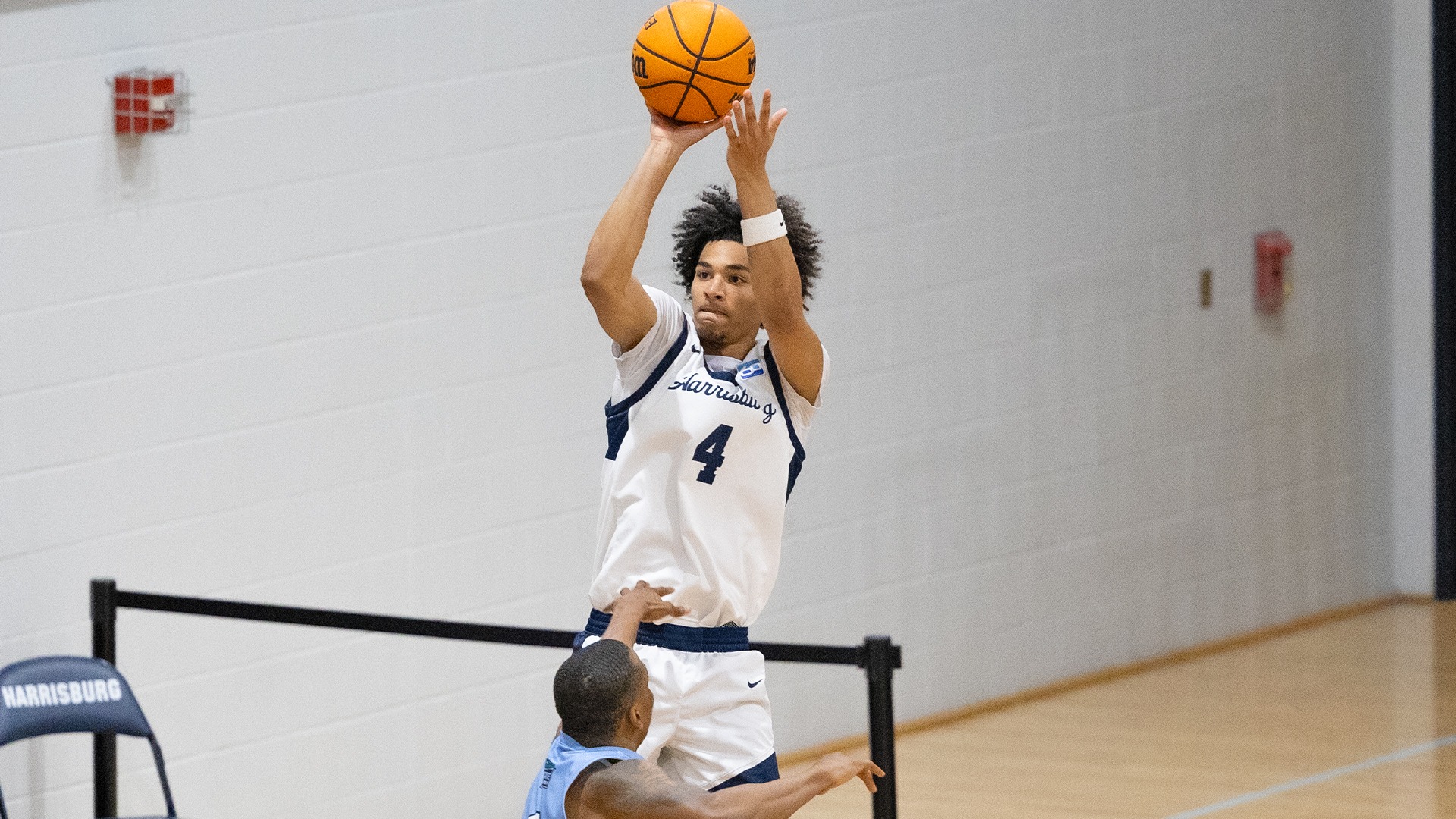 dylan moore rises up over a defender for a jump shot during a playoff win over notre dame (md.) in 2026