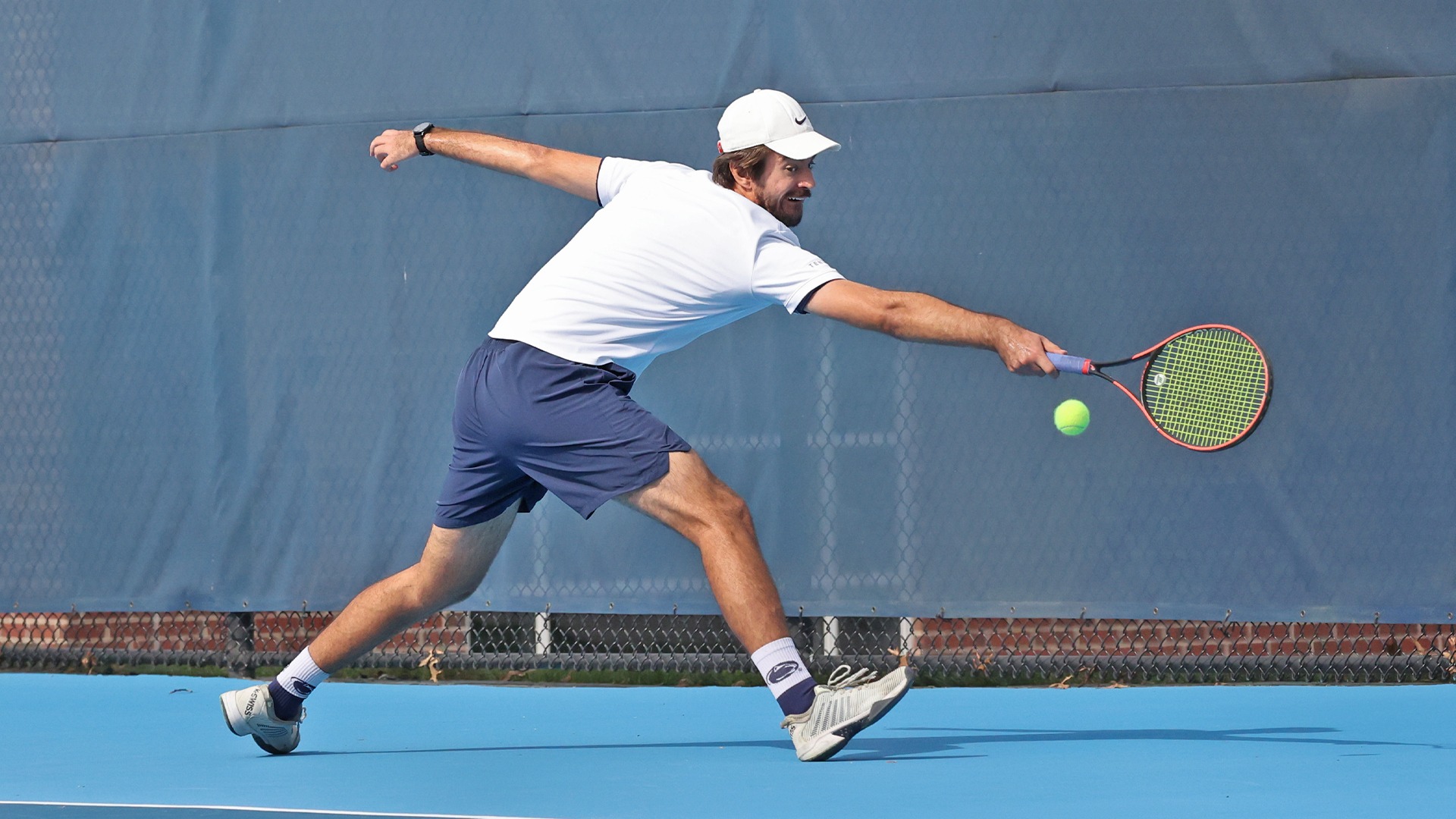 damir cuturic reaches to hit a ball at the hoverter tennis complex