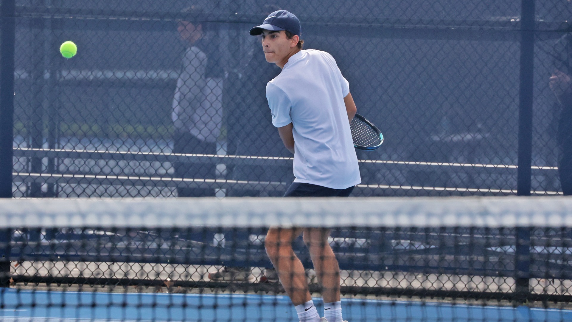 ian opitz prepares to hit a ball at the hoverter tennis complex