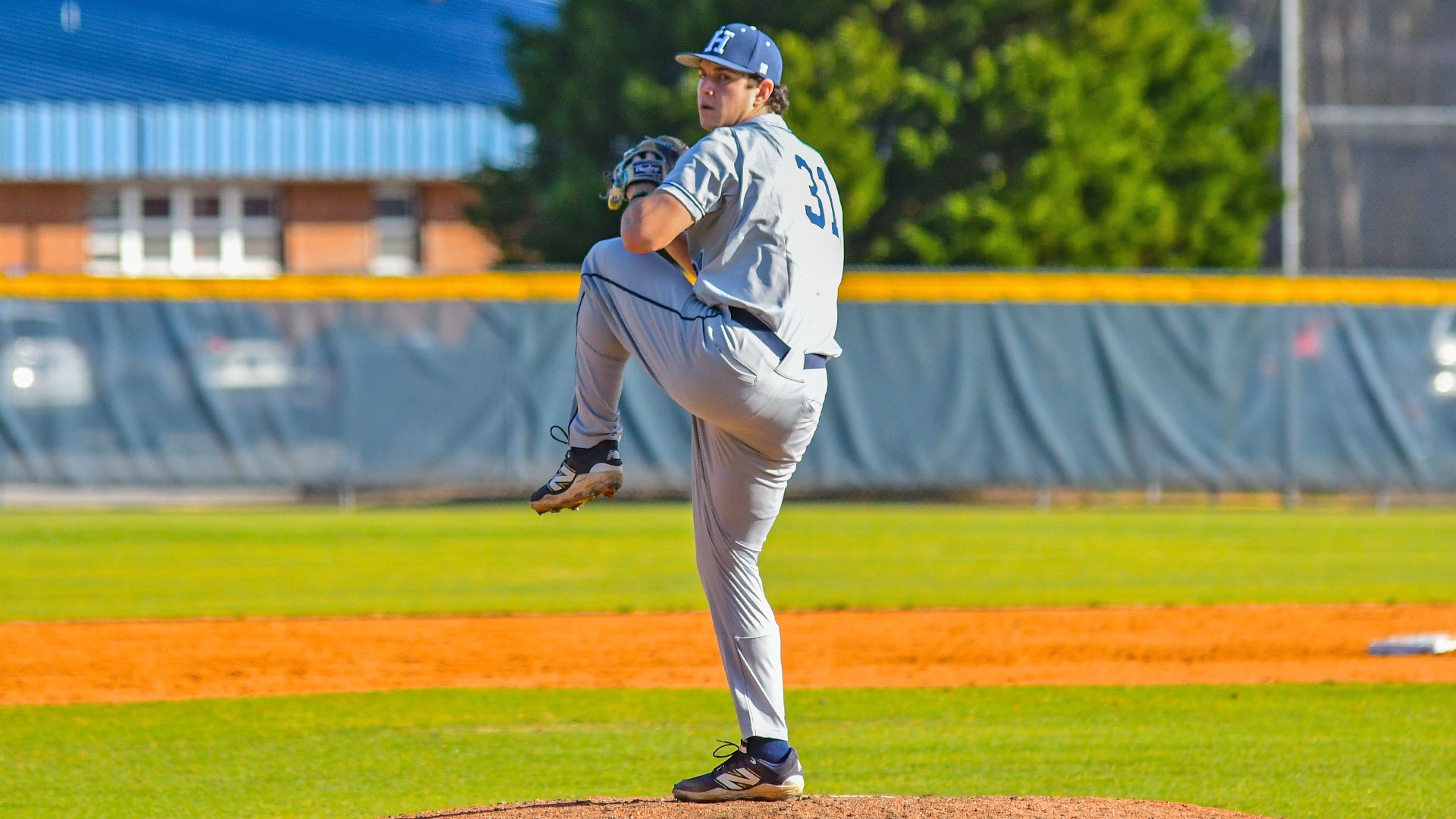 fisher druck lifts his leg on the mound before a pitch during a game at nc wesleyan in 2026