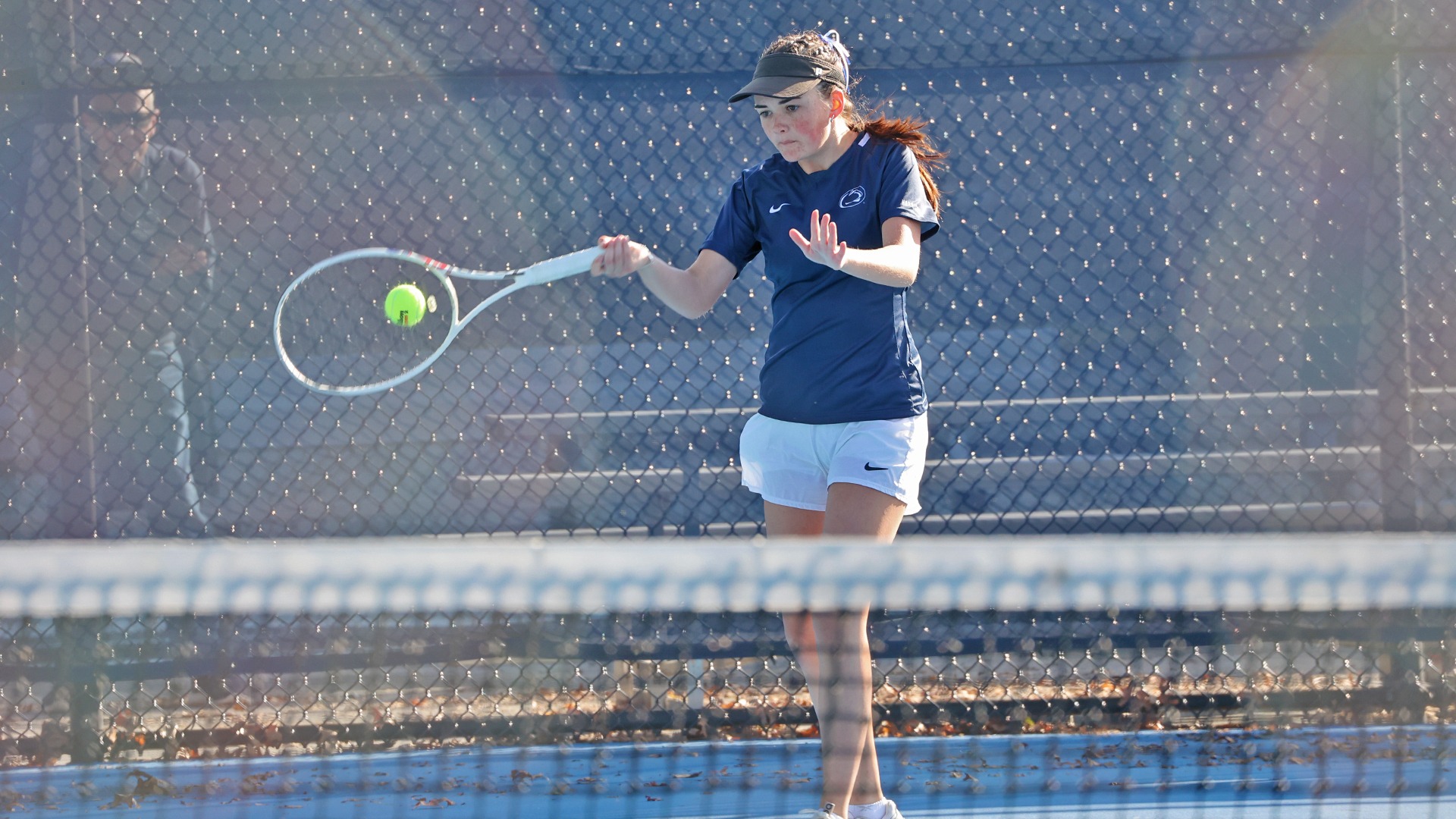 ava shepps hits the ball in a match at the hoverter tennis complex