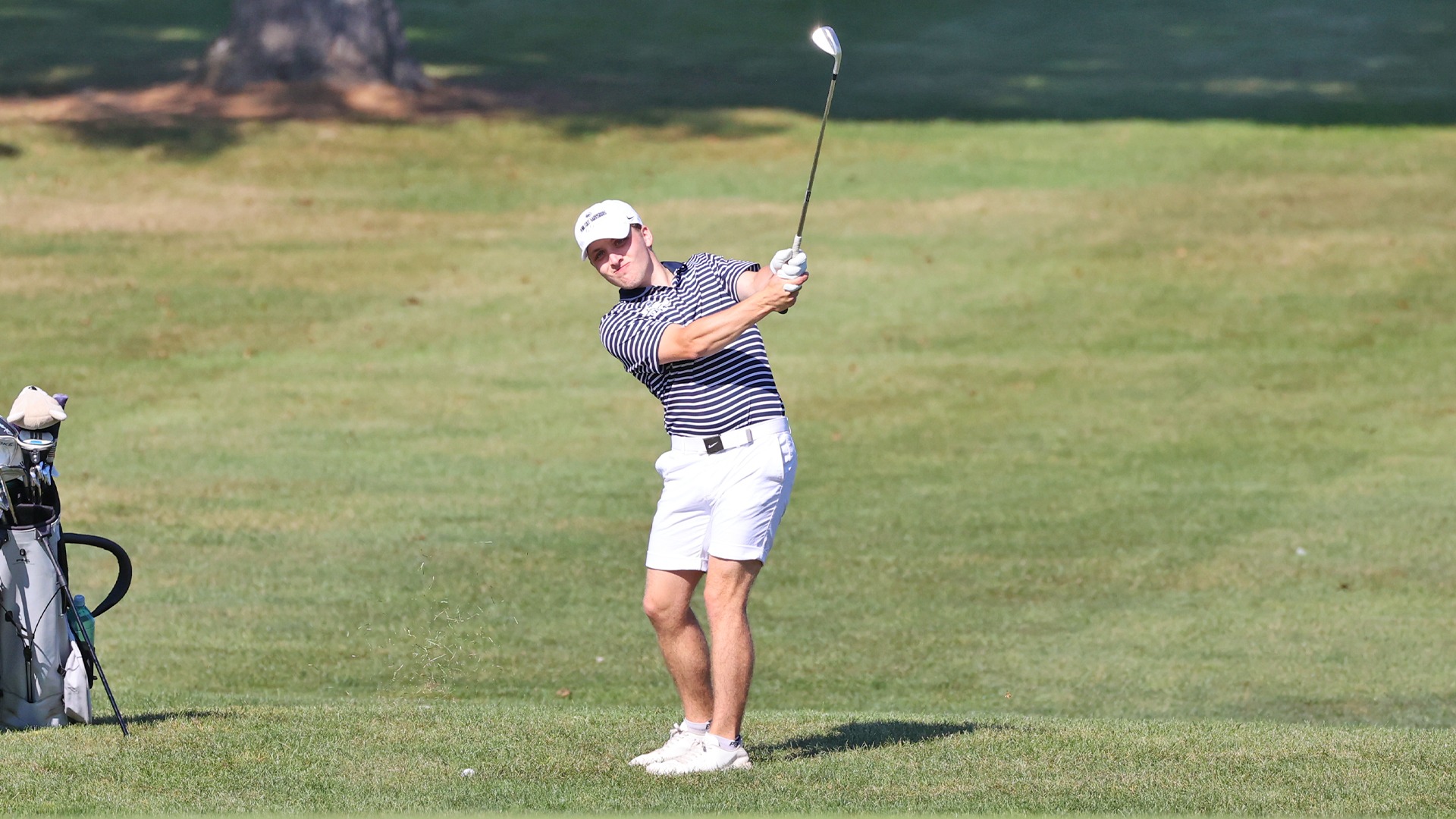 jacob lotz follows through on an iron shot during a match at hershey country club in the fall of 2025
