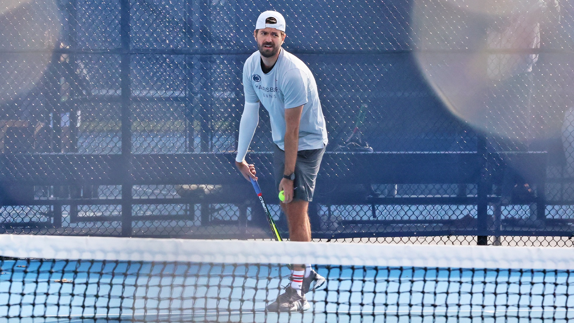 damir cuturic prepares for a serve during a win over penn college in 2026