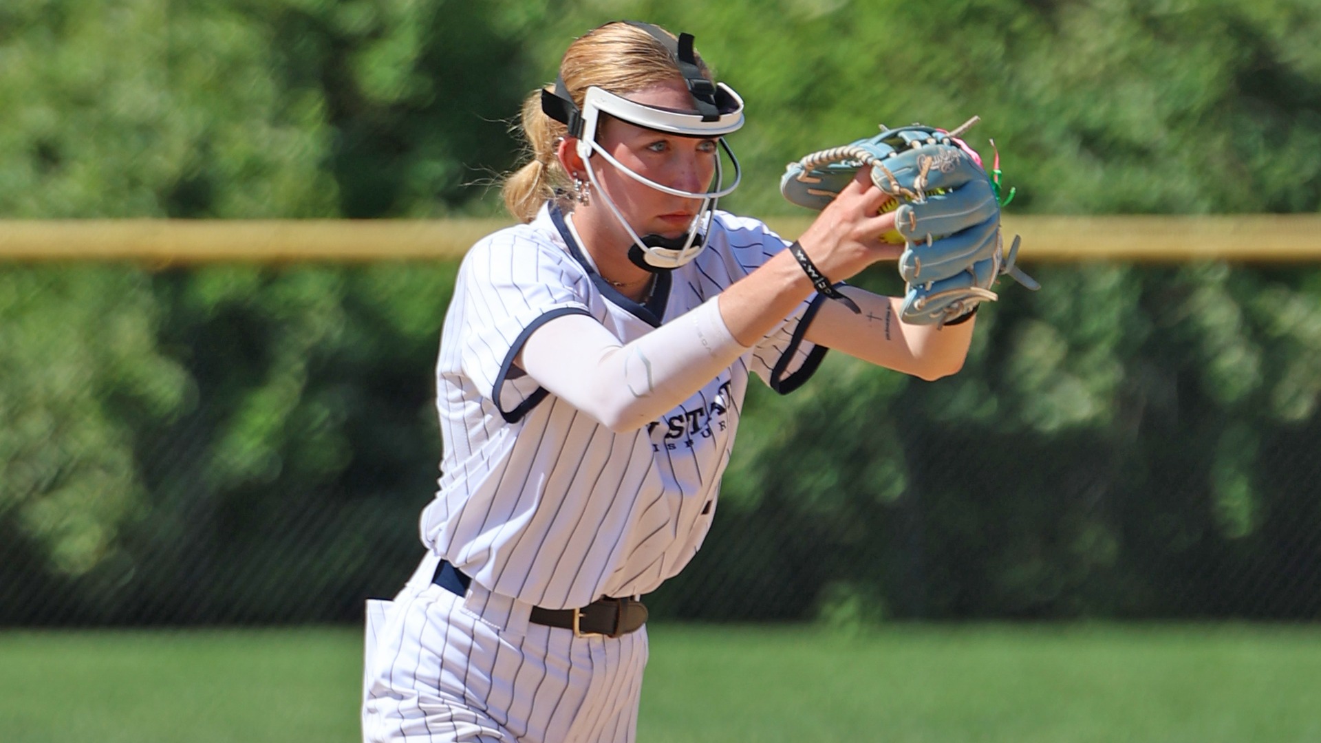 kylee miller gets ready to throw a pitch during a playoff game against penn college in 2025