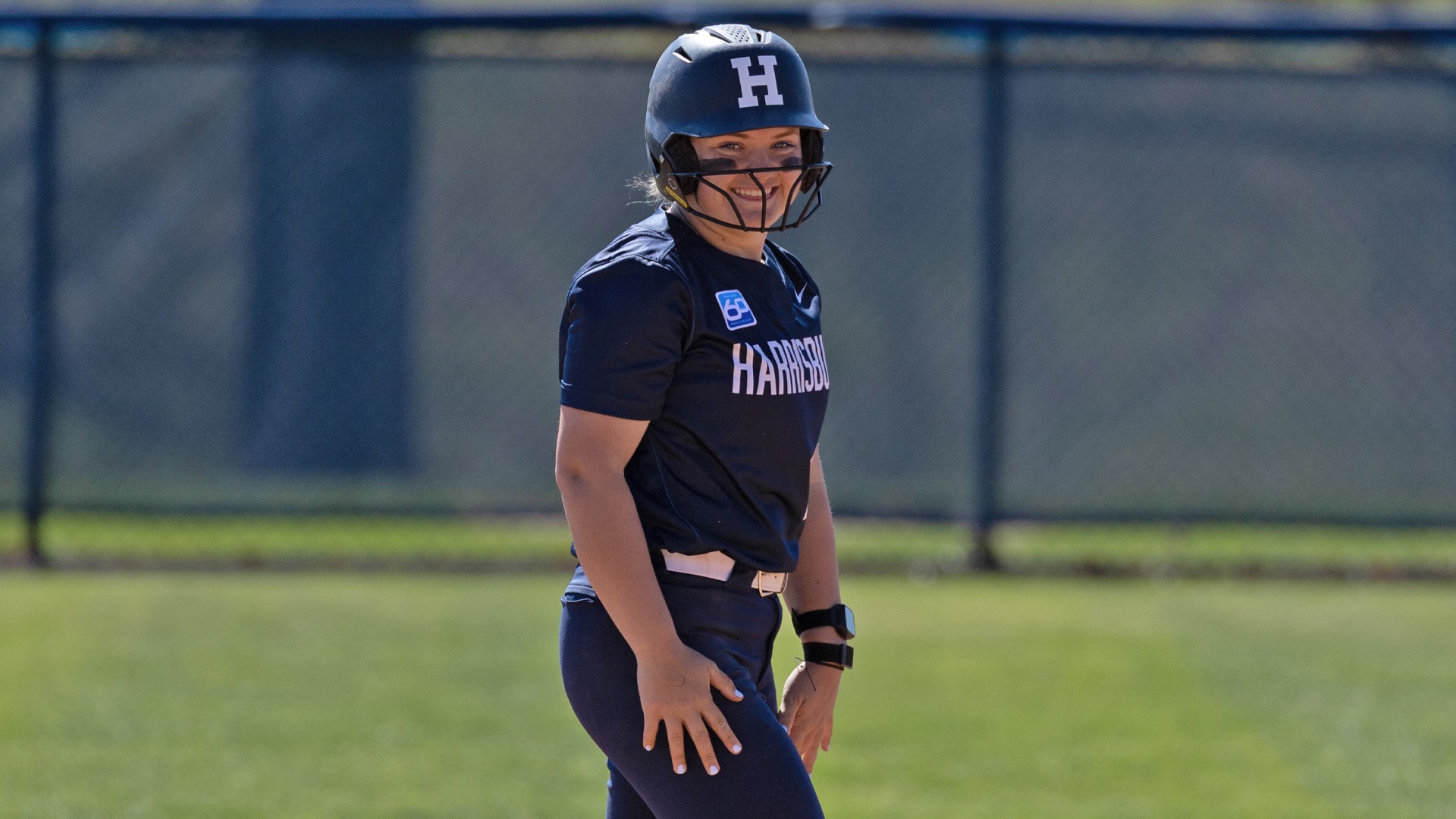 maddie minney smiles after hitting a triple against cairn