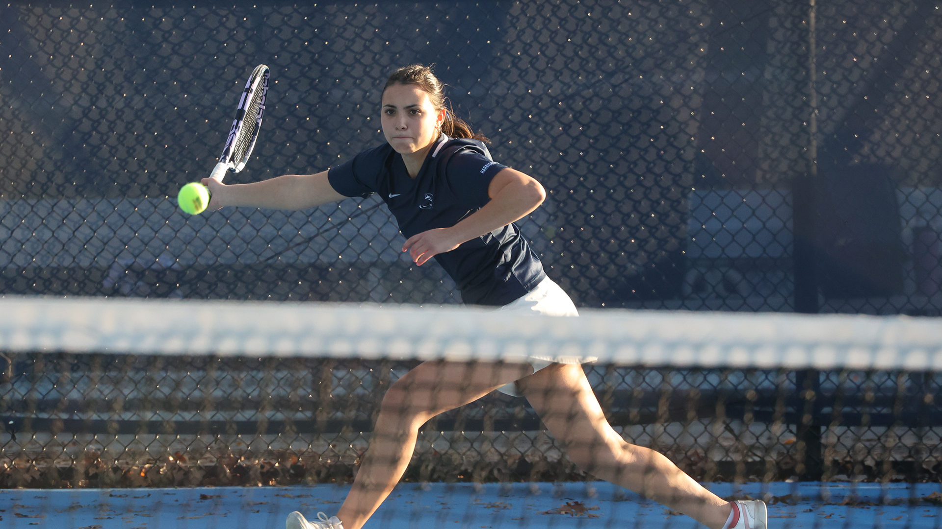 Mannino reaches for a ball in singles play