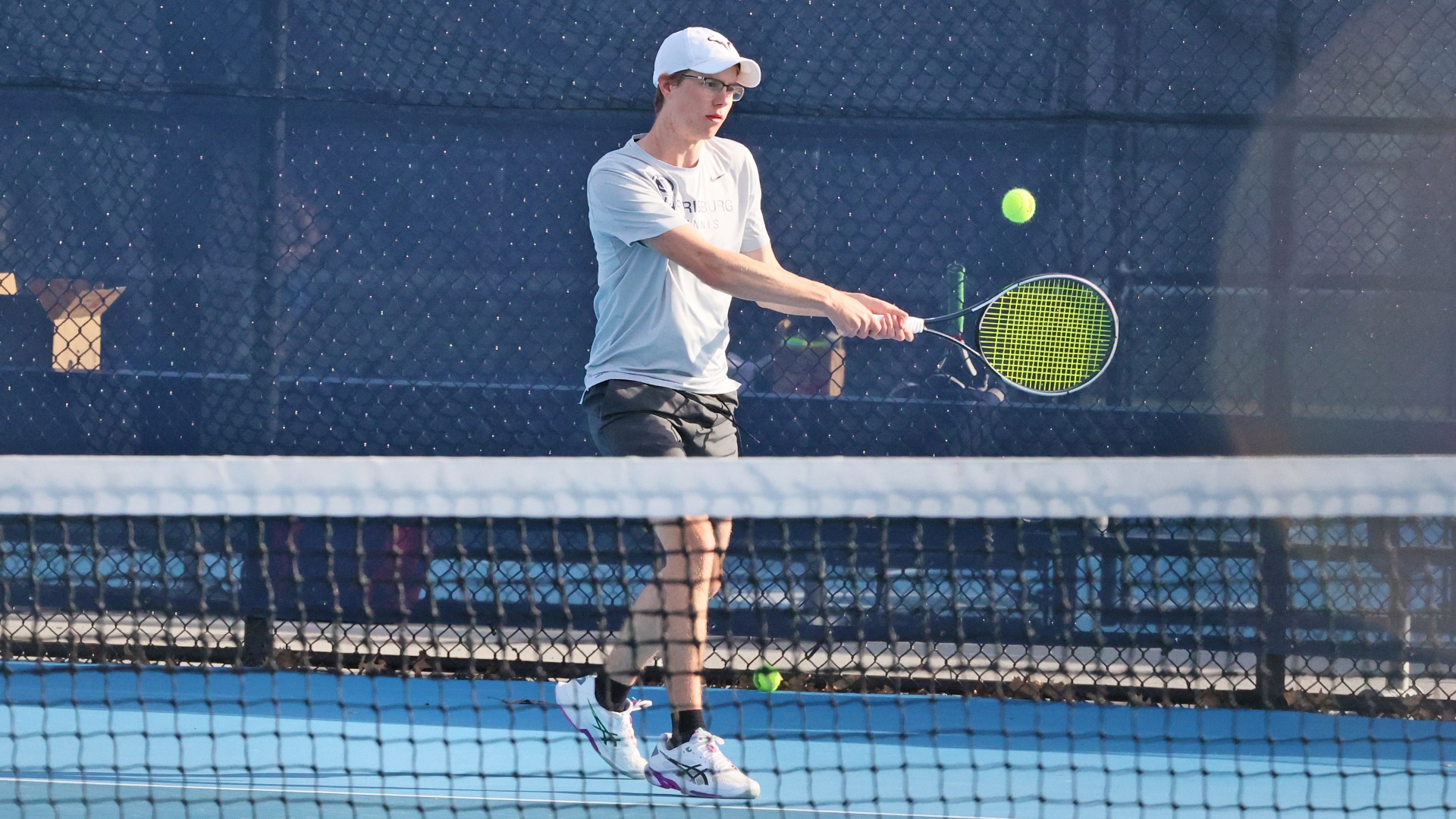 colin flack hits a ball at the hoverter tennis complex