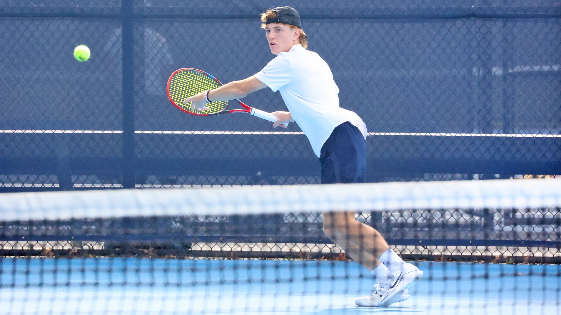 cooper wheeler returns a volley during a win over stevenson in 2025