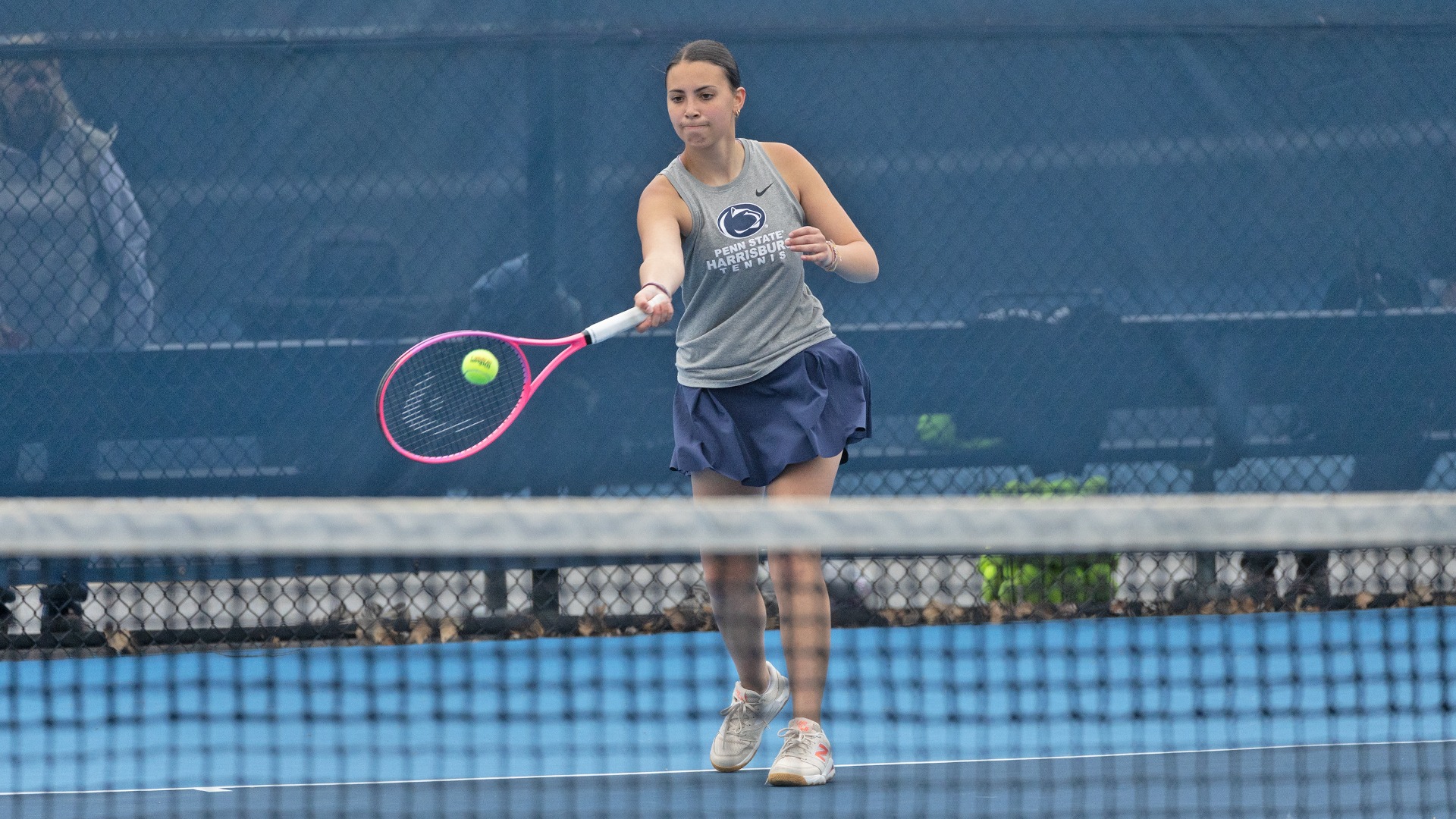 Rosalia Mannino hits a tennis ball in a match against penn college