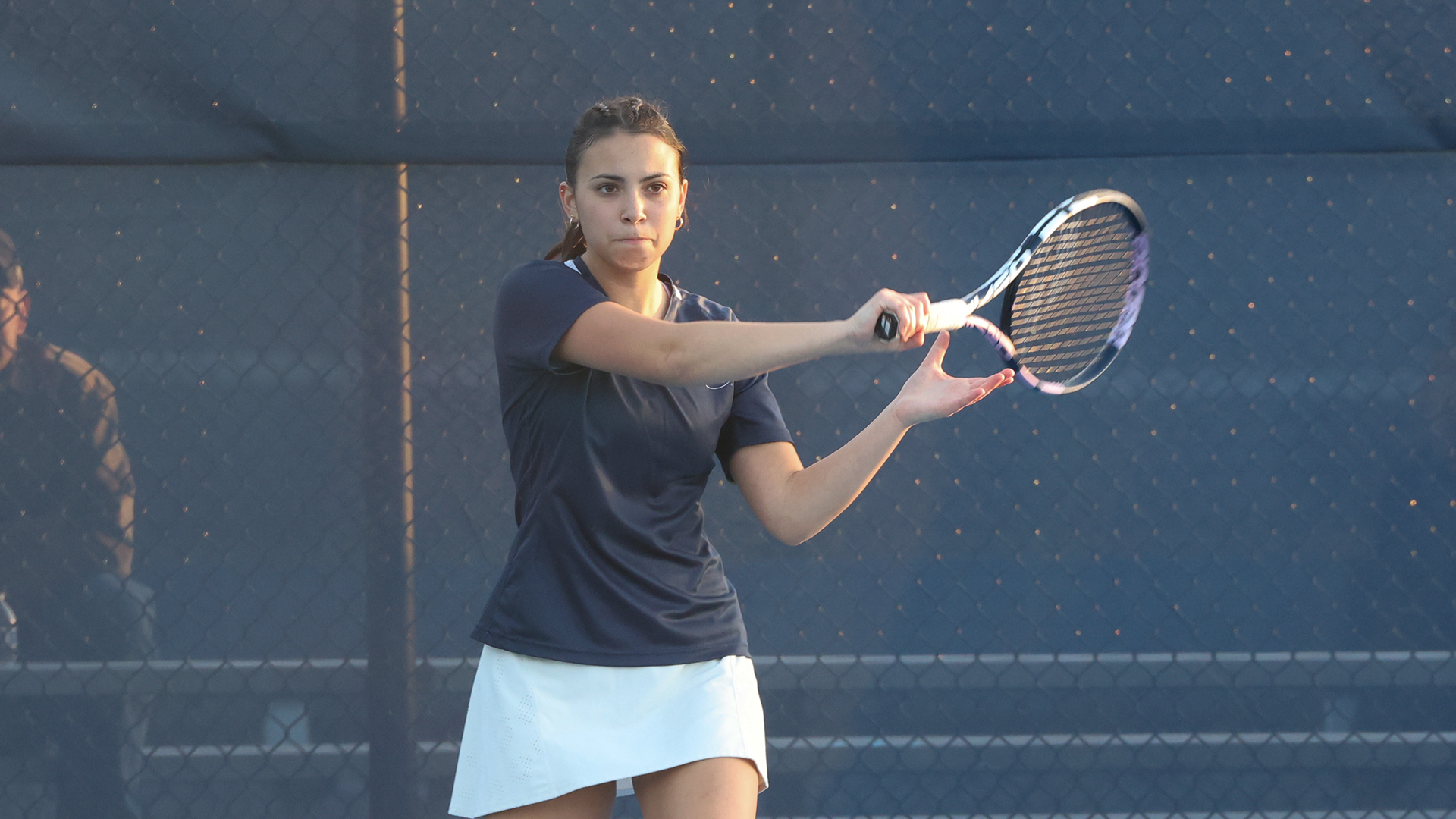 mannino returns a shot in a match against Penn State Berks