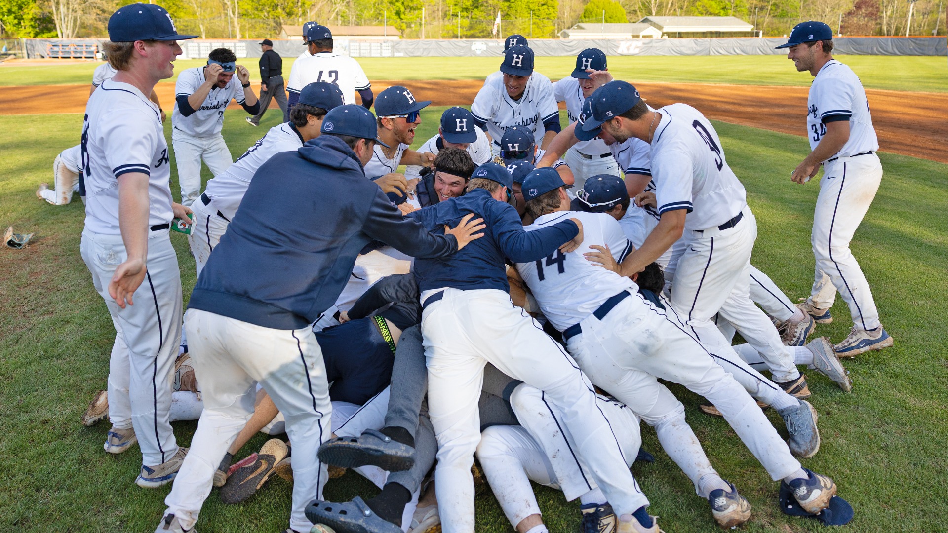 penn state harrisburg players dogpile on the pitcher's mound after winning the 2026 united east championship.jpg