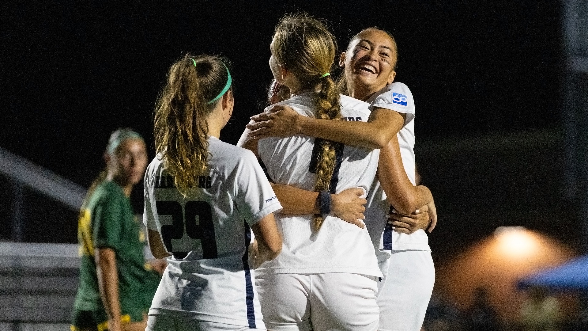 kylie yap celebrates with mackenzie mowery after a goal during a game against mcdaniel in 2025