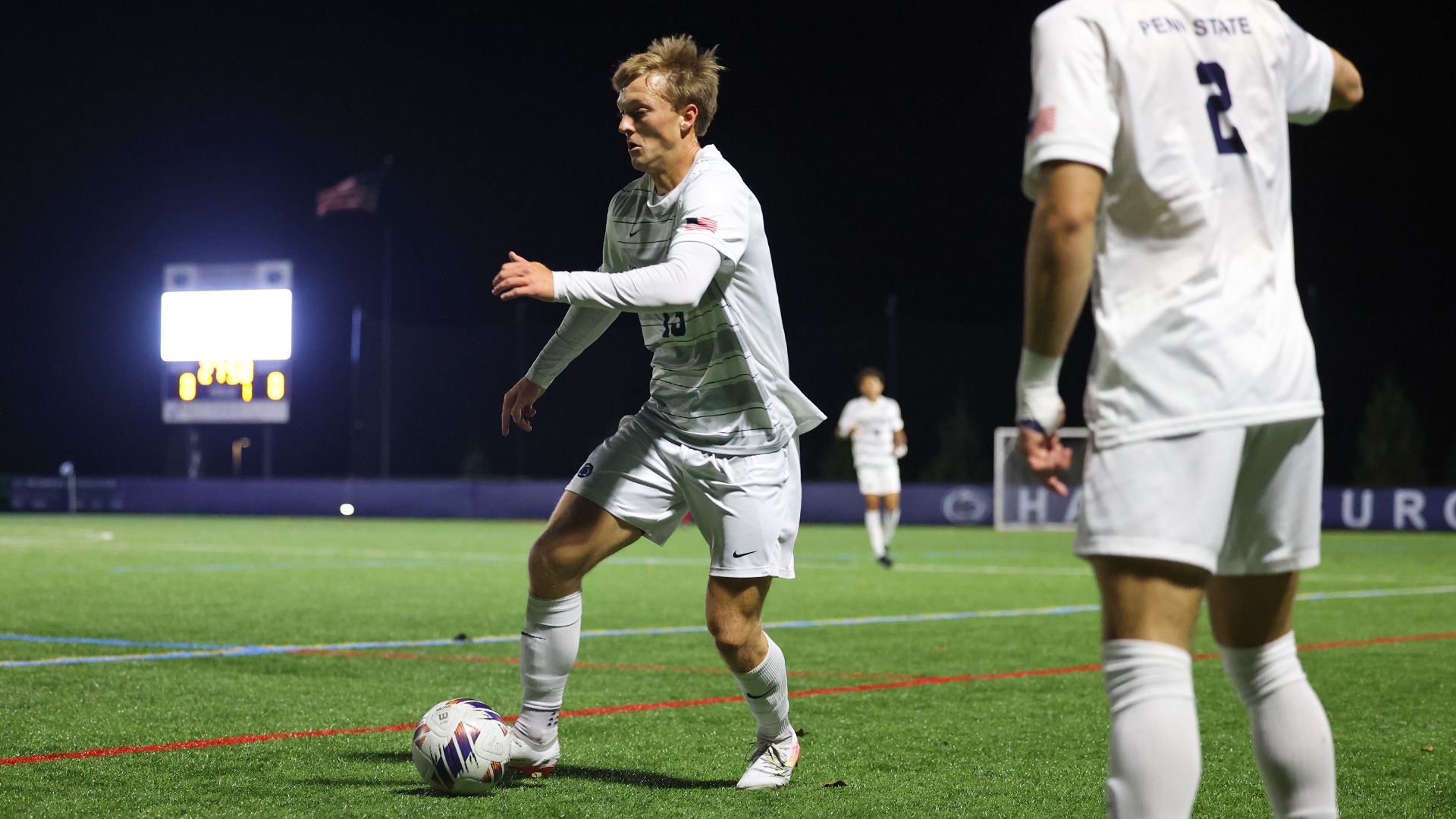 kristopher lage dribbles a ball near the sideline during a playoff game in 2025