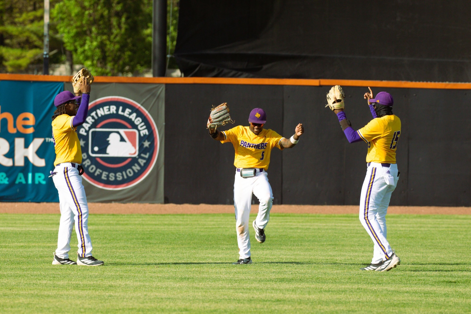 boys in the field celebrating