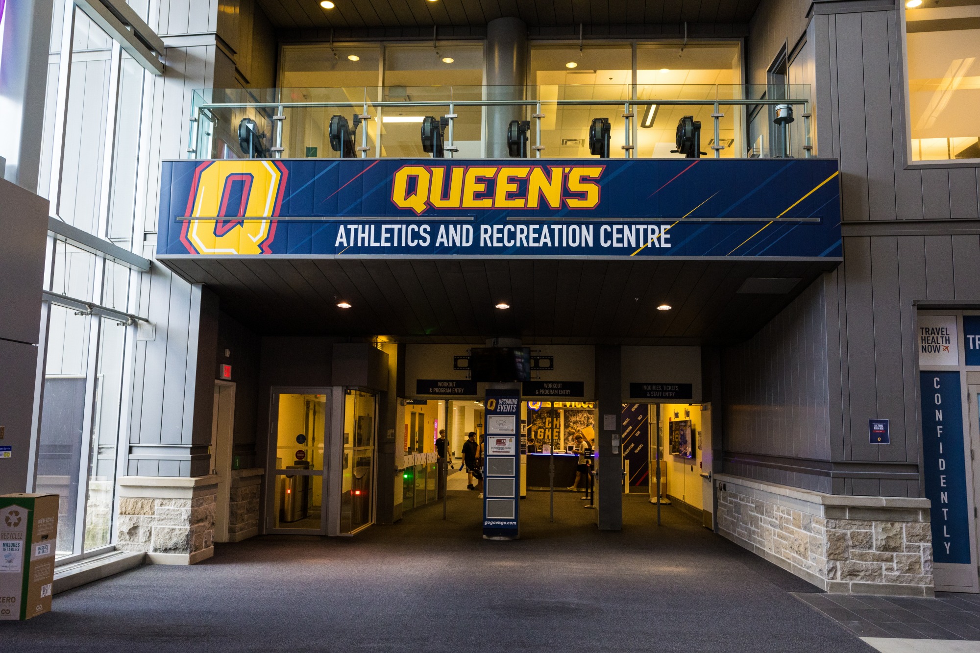 The main entrance to the Athletics and Recreation Centre. A banner is displayed over the entry with the Q logo on the left that says Queen's Athletics and Recreation Centre.