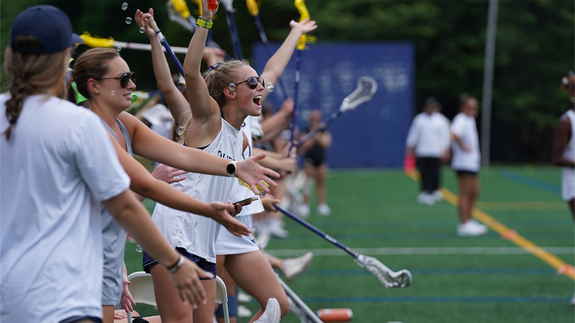 Ruby Gilbreth  cheering from sideline. 