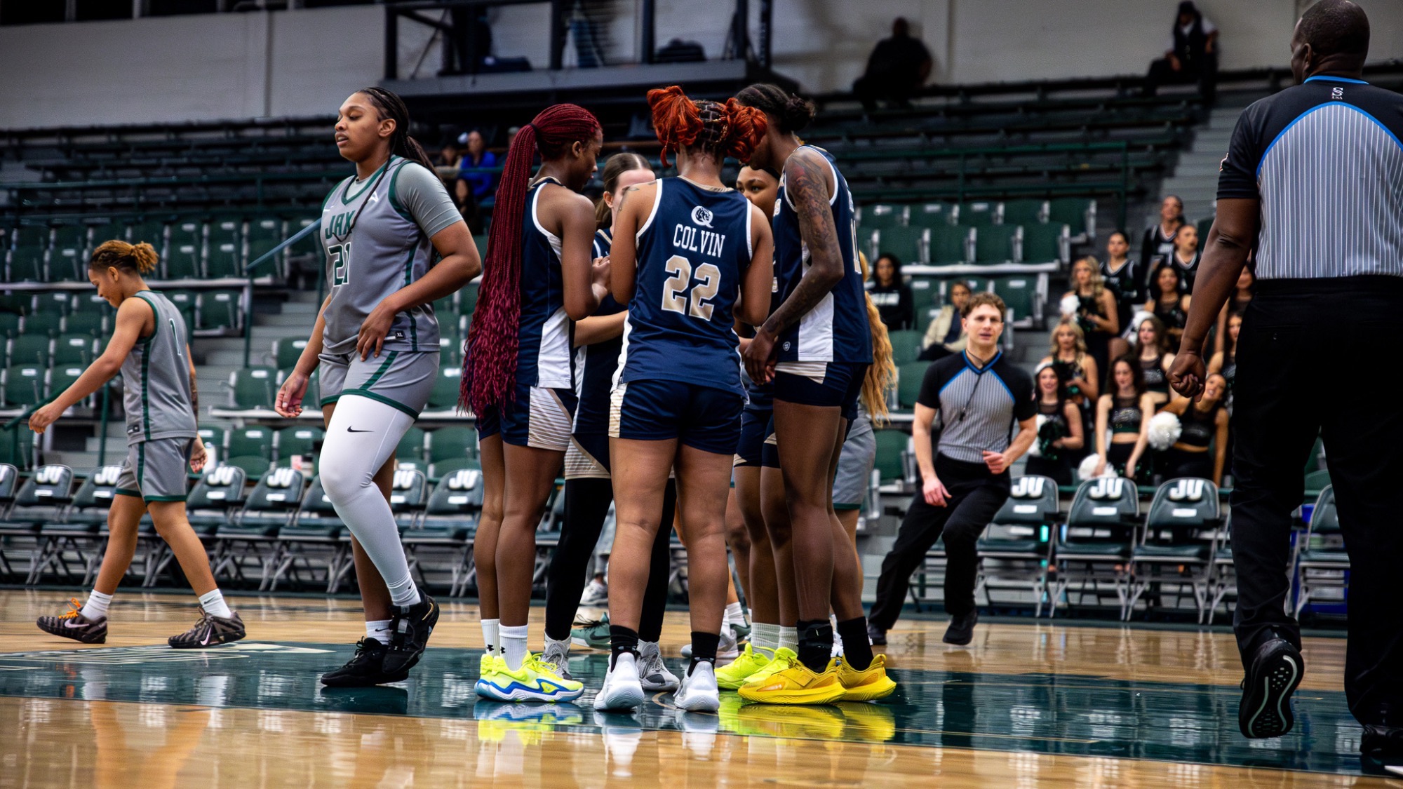 Women's basketball team huddle vs. Jacksonville