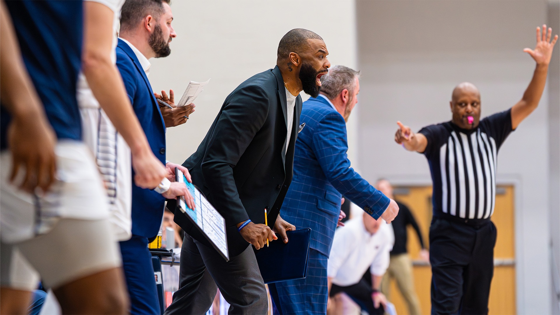 Sean Evans coaching from the bench against Central Arkansas