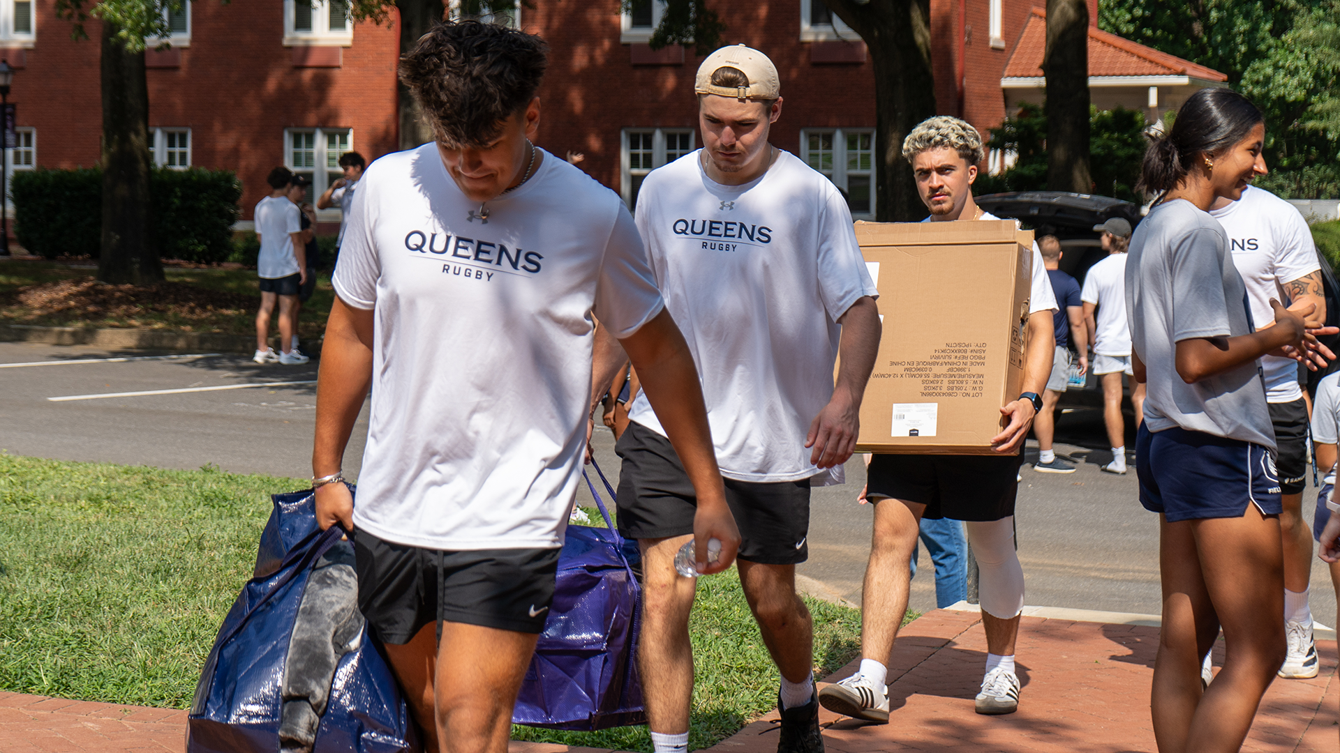 Men's rugby players on new student move-in day. 